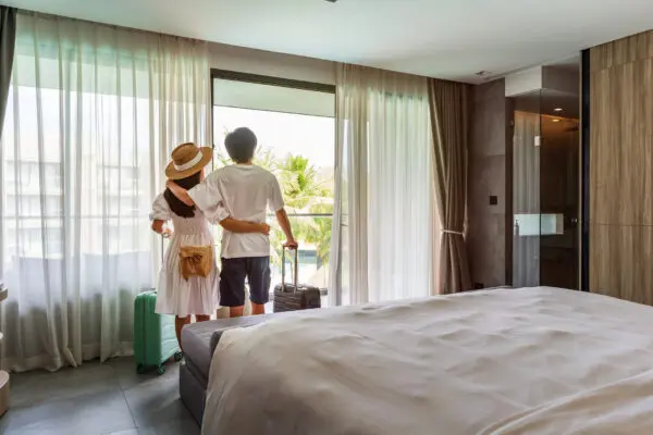 Couple admiring view from hotel room
